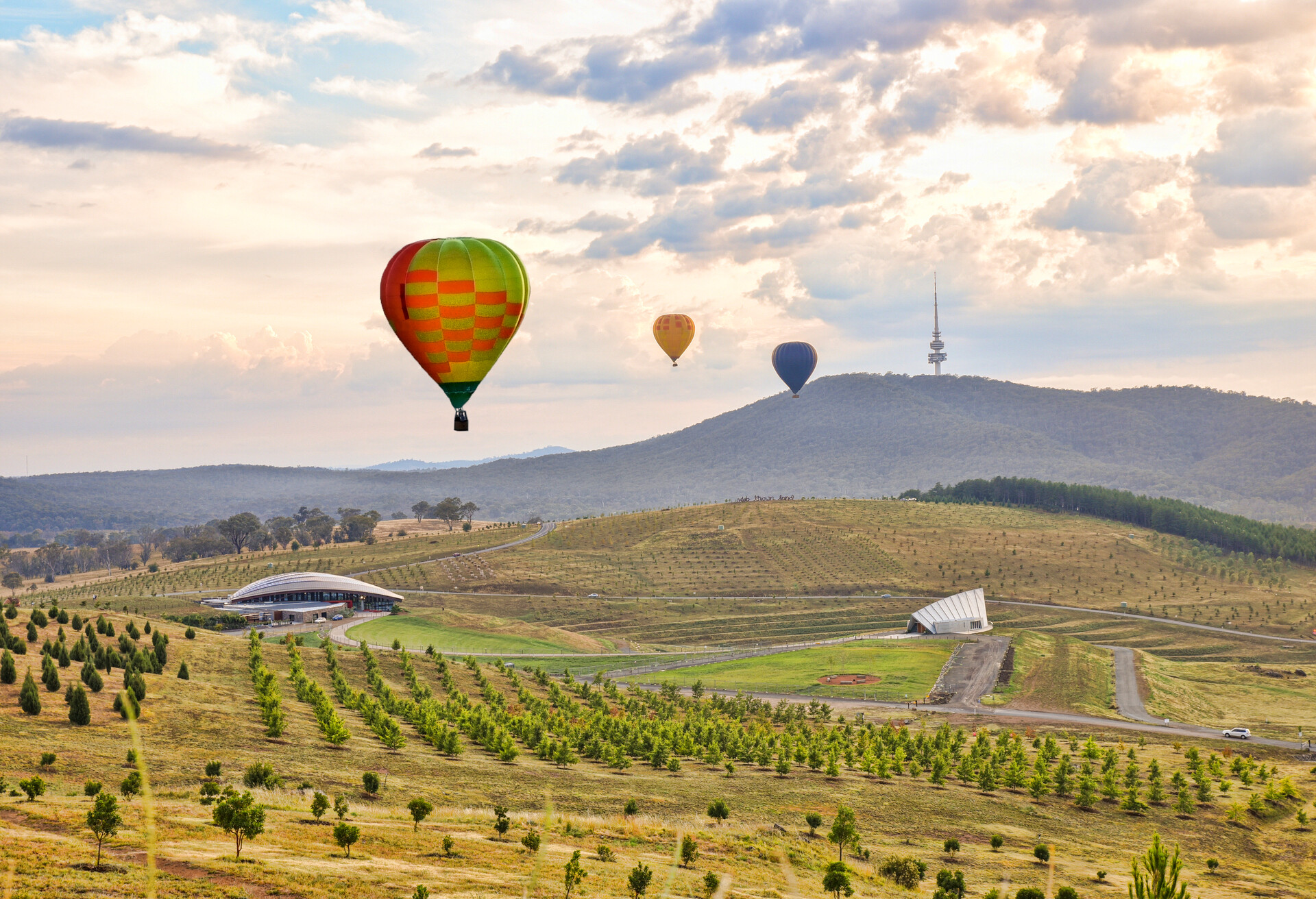 Canberra, Australia, 13 March 2016. During Canberra Balloon Spectacular, many balloons fly over Canberra city and Lake Burley Griffin. Every morning at dawn, more than 30 balloons take off from the lawns in front of the Old Parliament House.