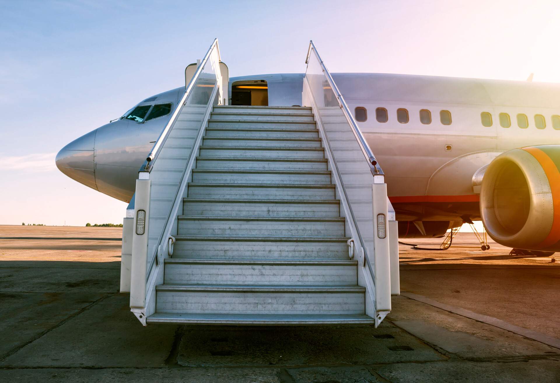 An aircraft with its boarding stairs deployed. 