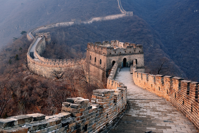 Great Wall sunset over mountains in Beijing, China_shutterstock_142871650