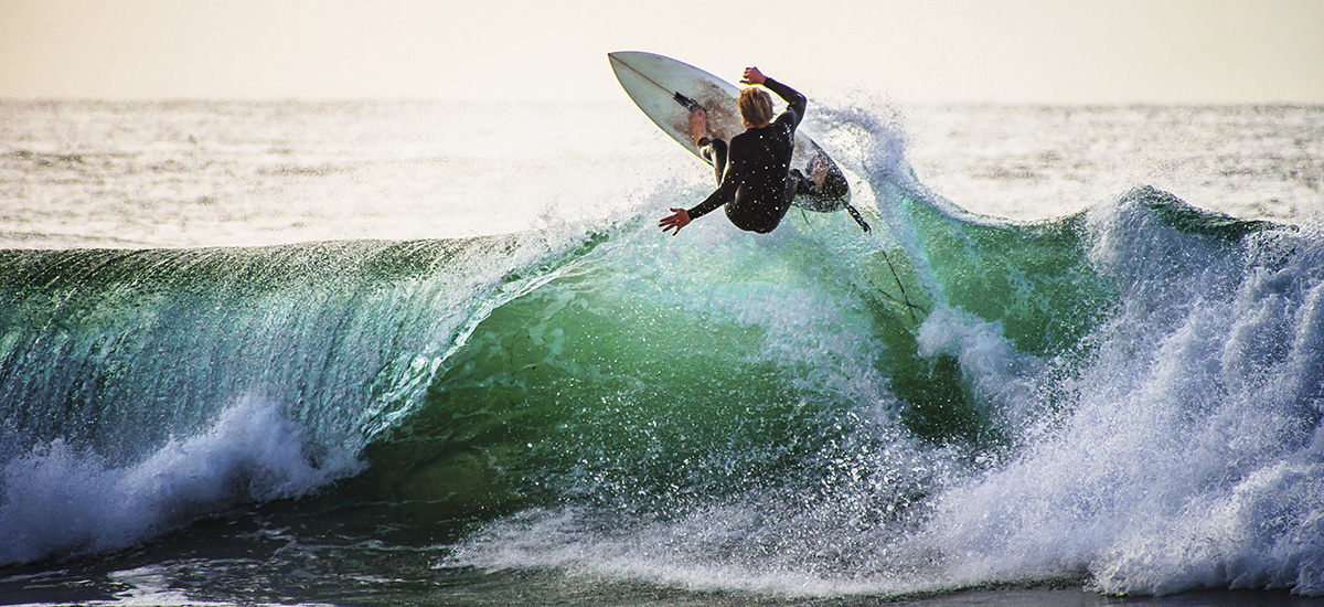 Surfer rides a wave in Australia