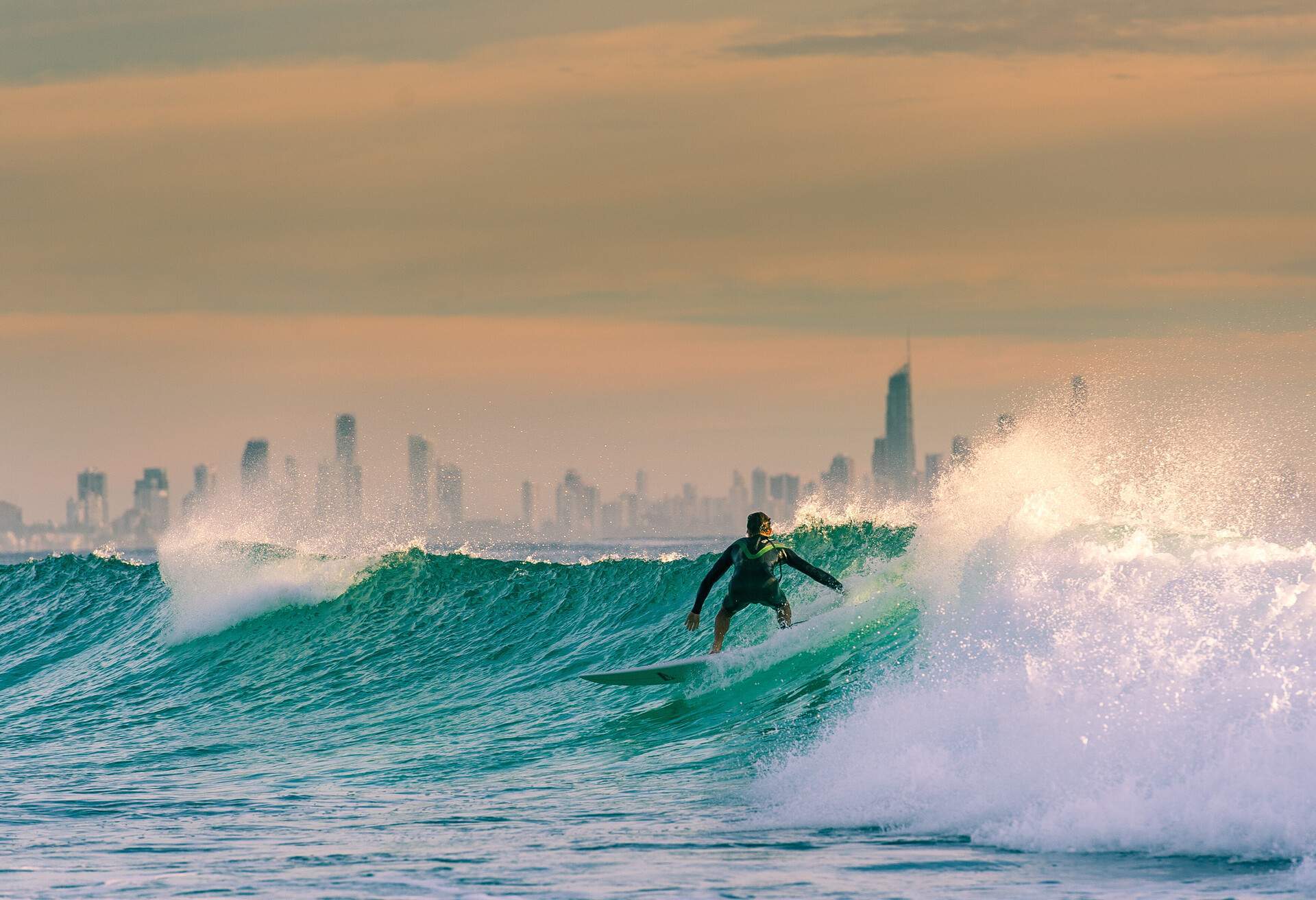 A morning surf on the gold coast. Sunrise near snapper rocks with Surfers Paradise in the background