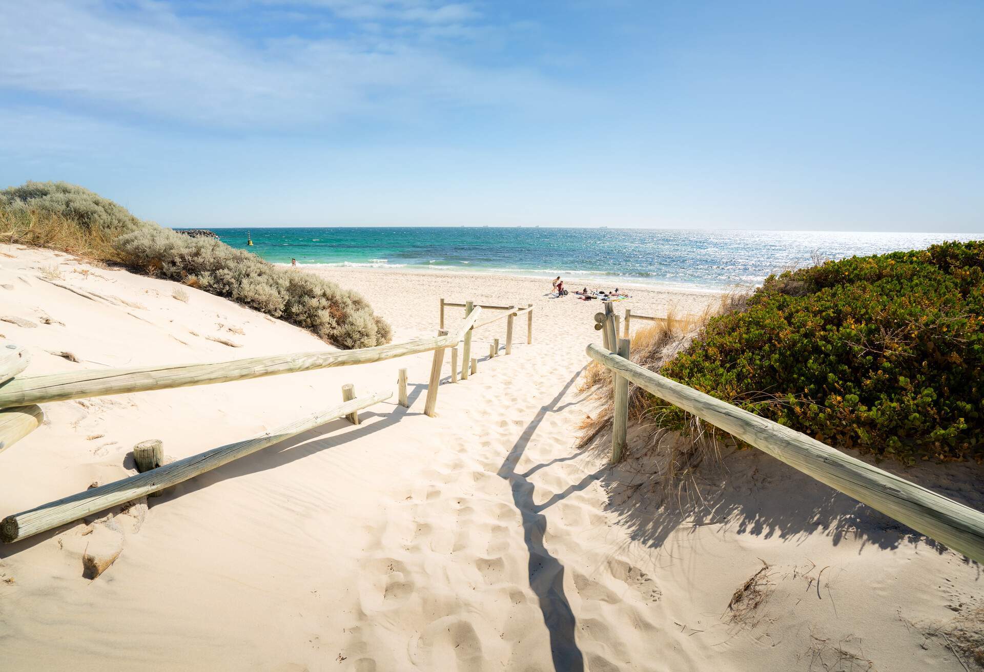 Famous place Cottesloe Beach with tourist lying to sunbath and swimming on a summer afternoon in Perth, Western Australia, Australia.