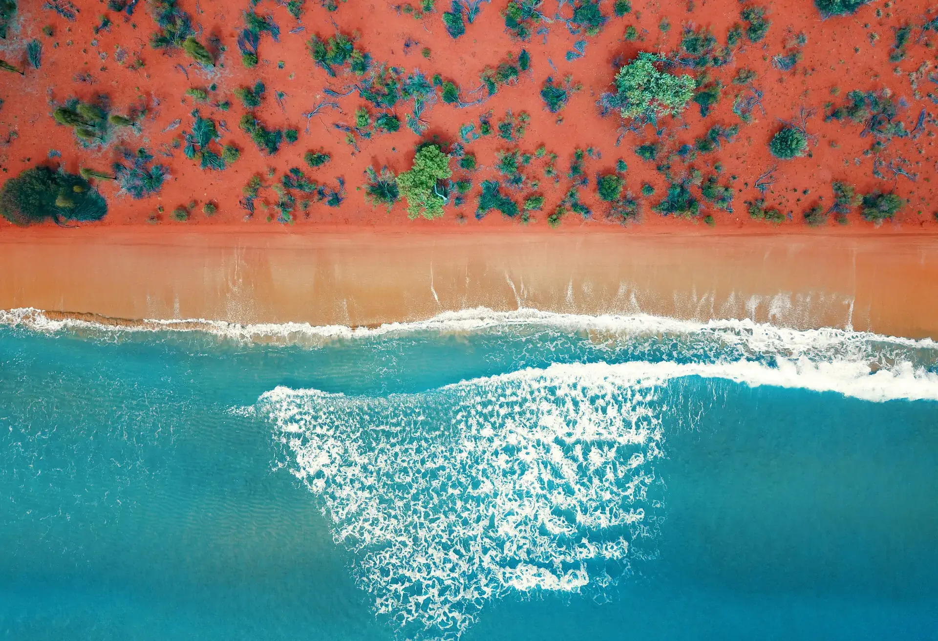 Natural bright orange sandy beach from above