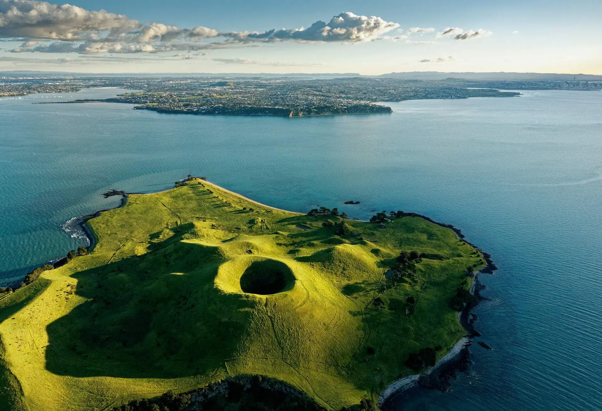 Overhead view of Browns Island, Motukorea,in the Hauraki Gulf looking towards Auckland's eastern suburbs, unspoilt and open to visitors