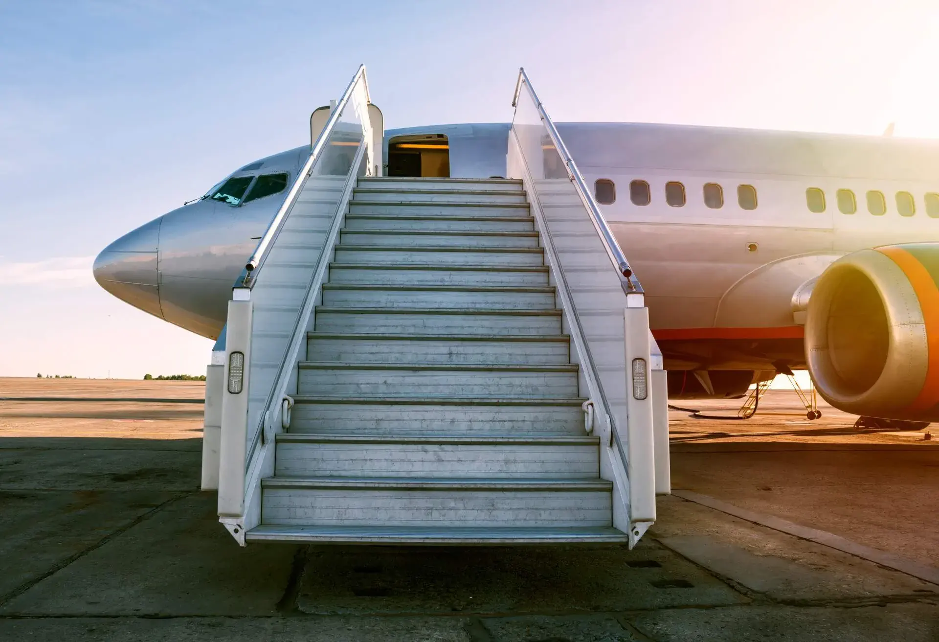 An aircraft with its boarding stairs deployed. 